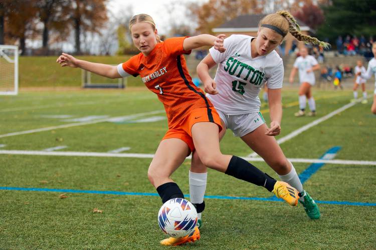 South Hadley’s Lauren Marjanski (7), left, fights to get past Sutton defender Molly Jenkins (15) in the second half of the MIAA Division 4 girls soccer championship Saturday at Doyle Field in Leominster.
