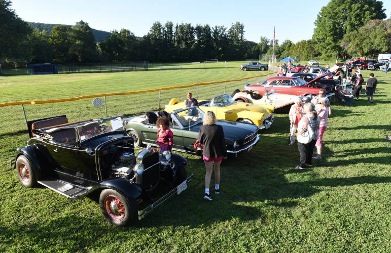 Attendees check out a 1931 Ford Model A Roadster, a 1966 Ford Mustang, a 1956 Ford Thunderbird and other classic cars at the South County Senior Center’s Informational Fair & Cruise Night in Sunderland in 2023. This year’s event, set for Wednesday, Aug. 21, will be held at Herlihy Park in Whately.