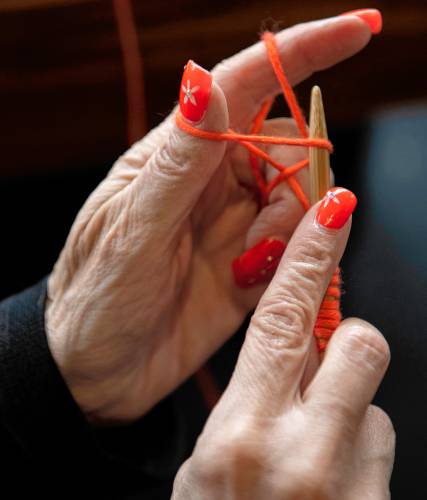 Liz Ferris, a member of the Friday Morning Class for experienced knitters, works on a piece during a  recent afternoon at  Northampton Wools.