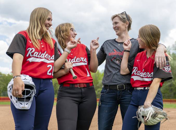 Becky Dubay, second from right, laughs with her daughters from left: Raegan, 16, Ryanne, 16, and Kalin, 14, before softball practice at Hampshire Regional High School, Thursday, May 8, 2025, in Westhampton.