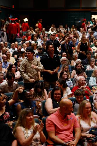 Audience members cheer as Hampshire Regional graduates receive their diplomas during the Class of 2025 commencement ceremony Friday evening in Westhampton.