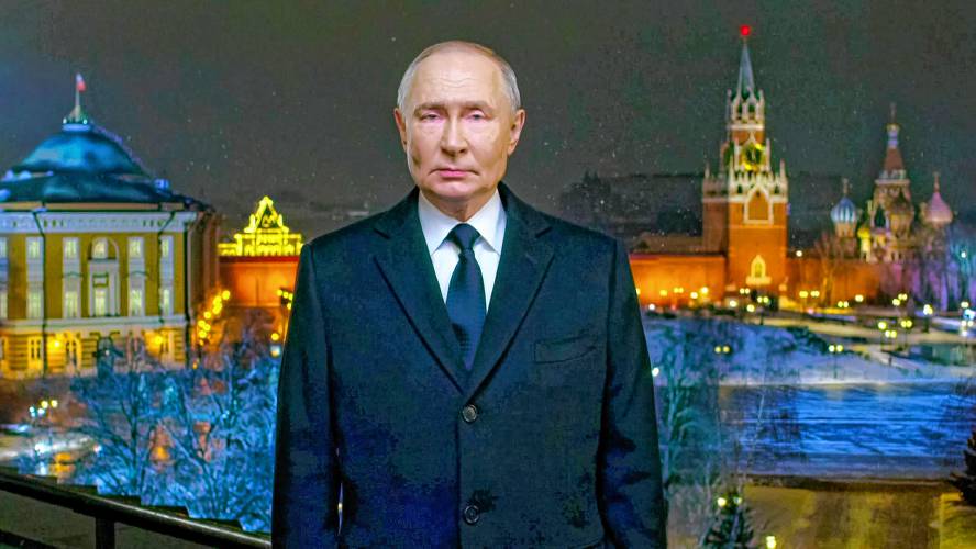 In this photo taken from video released by Kremlin Press service on Tuesday, Dec. 31, 2024, Russian President Vladimir Putin speaks during a recording of his annual televised New Year's message on New Year's eve in the Kremlin in Moscow, Russia. (Kremlin Pool Photo via AP)