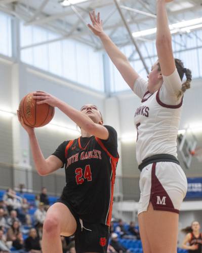 South Hadley's Kate Phillips (24) attempts a layup during the MIAA Division 4 state semifinal basketball game against Millis at Worcester State University, Wednesday, March 12, 2025, in Worcester.