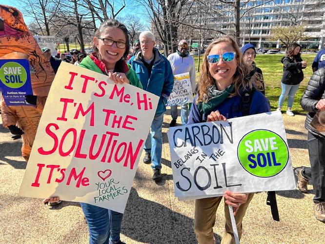 Sarah Voiland of Red Fire Farm, left, marches with a new friend, Janet Aardema of Broadfork Farm in Virginia, during a Farmers for Climate Action rally in Washington, D.C., organized by the National Sustainable Agriculture Coalition.