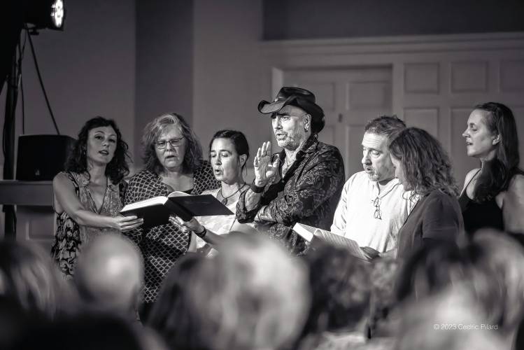 Tim Eriksen, in hat, joins other singers at the Bombyx Center at a previous show. The Amherst musicologist and multi-instrumentalist has organized a Nov. 18 show at the Florence music and community center that looks back to an 1873 concert at the Florence Congregational Church.  
