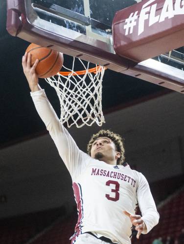 UMass guard Marqui Worthy (3) attempts a layup during the college basketball game against Davidson at the Mullins Center, Wednesday, Feb. 12, 2025, in Amherst.