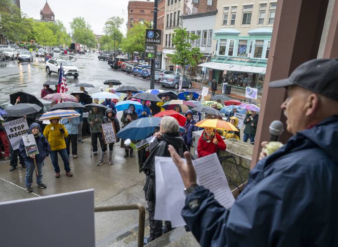 Harvard Professor Richard Tedlow speaks during a White Rose rally outside Northampton City Hall, Friday in Northampton. The rally was started by John Paradis who stated in a Gazette guest column that he would, “hold a white rose at noon at the intersection of King and Main streets in Northampton,” and received local support from Indivisible Northampton/Swing Left Western Mass.