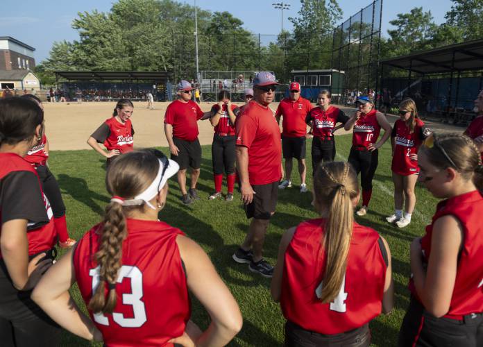 Hampshire Regional Head Coach Brian Mcgan talks to the team after losing the MIAA Division 4 semifinal softball game against Joseph Case at Worcester State University, Thursday, June 12, 2025, in Worcester.