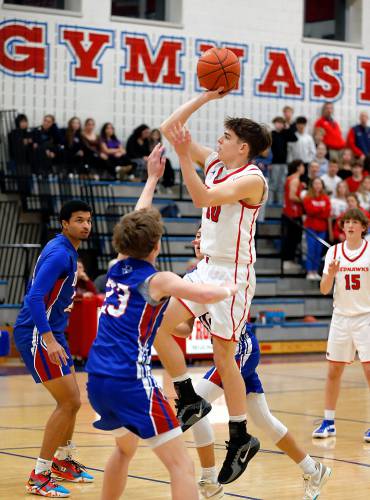 Frontier’s Max Millette (10) drives to the hoop against Drury in the first quarter Friday night at Goodnow Gymnasium in South Deerfield.