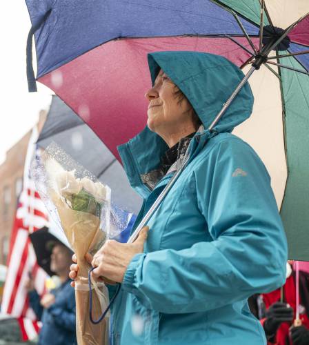 The Rev. Margaret Bullitt-Jonas listens to speakers during a White Rose rally outside Northampton City Hall, Friday in Northampton.