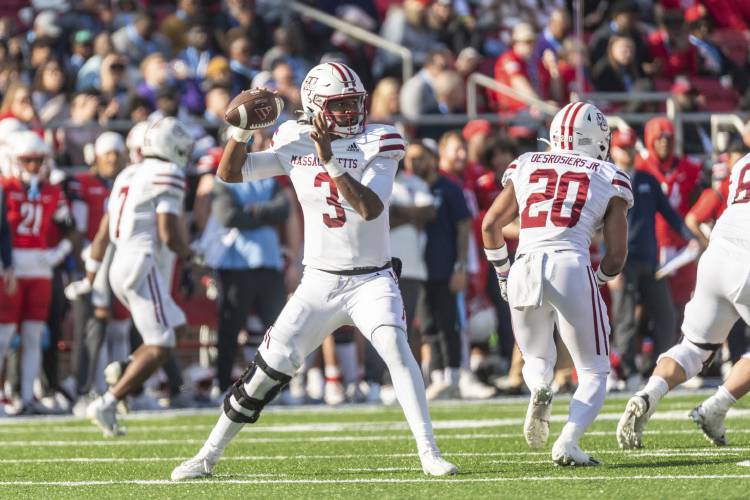 UMass' Taisun Phommachanh looks to throw down field against Liberty during the first half on Saturday  in Lynchburg, Va.