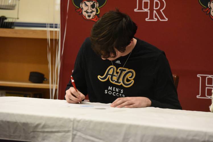 Hampshire Regional’s Elijah Picard signs his National Letter of Intent to play collegiate soccer at AIC on Friday afternoon in Westhampton.