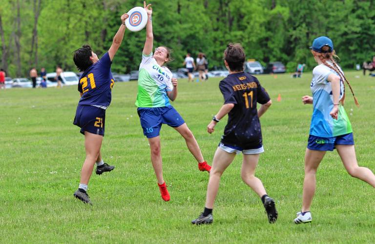 Northampton sophomore Amelia Durbin leaps to catch a goal over a Cimes defender on Saturday afternoon of the Pioneer Valley Invitational tournament at Oxbow Marina in Northampton.