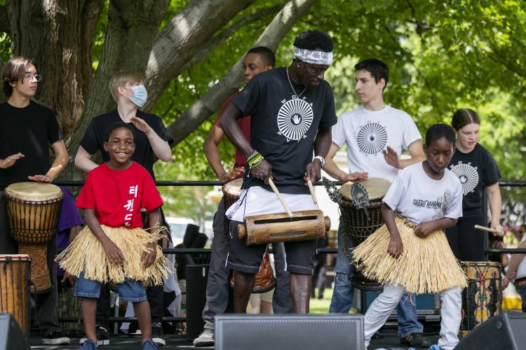 Alpha Kabisko Kaba leads a spirited performance with the Pioneer Valley Performing Arts School’s African Dance and Drum Company during a Jubilee Celebration in honor of Juneteenth in 2021 on the Amherst Town Common.