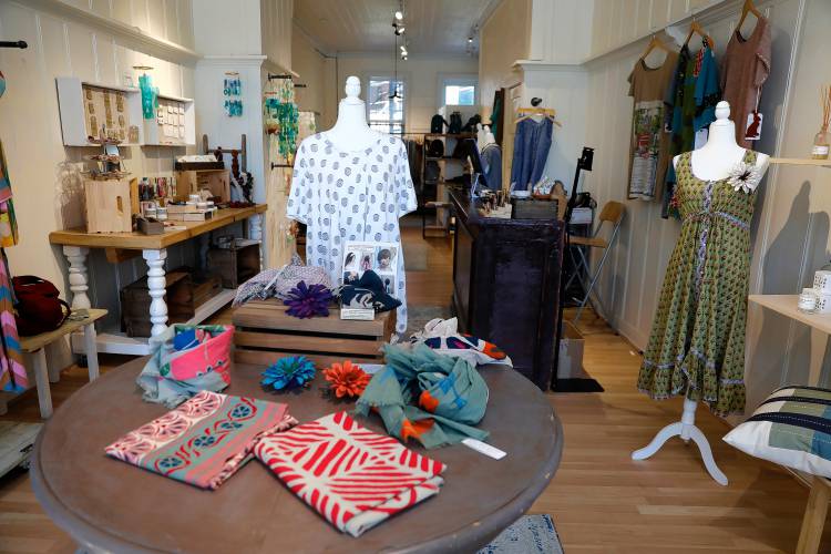 Some of the clothing, accessories and art for sale at Plum, a boutique that recently relocated to downtown Northampton from Greenfield.