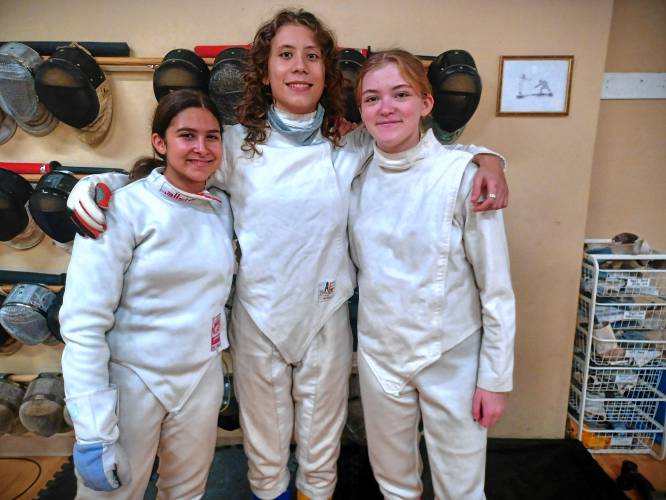 Pictured is Pioneer Valley Fencing Academy and Northampton High School fencers Willa Barman (left, junior captain), River Burnell-Wojtech (middle, junior) and senior Klara Sokop (right, senior). These three make up the Blue Devils’ epee team, which has gone undefeated in its past two competitions. Pictured is Pioneer Valley Fencing Academy and Northampton High School fencers Willa Barman (left, junior captain), River Burnell-Wojtech (middle, junior) and senior Klara Sokop (right, senior). These three make up the Blue Devils’ epee team, which has gone undefeated in its past two competitions.
