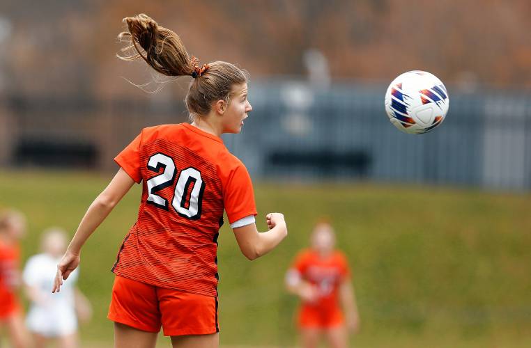 South Hadley’s Margo Watkins (20) sends a header upfield against Sutton in the first half of the MIAA Division 4 girls soccer championship Saturday at Doyle Field in Leominster.