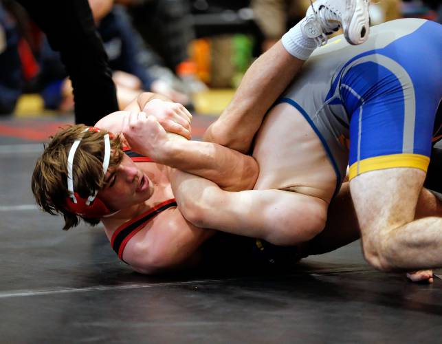 Hampshire Regional’s Luke Johndrow competes to a second place finish against Gateway’s Eli Gilbert in the 165-pound final Saturday during the MIAA Division 3 Western Mass wrestling championships at Mount Greylock Regional School in Williamstown. 